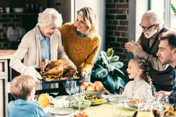 family enjoying thanksgiving meal