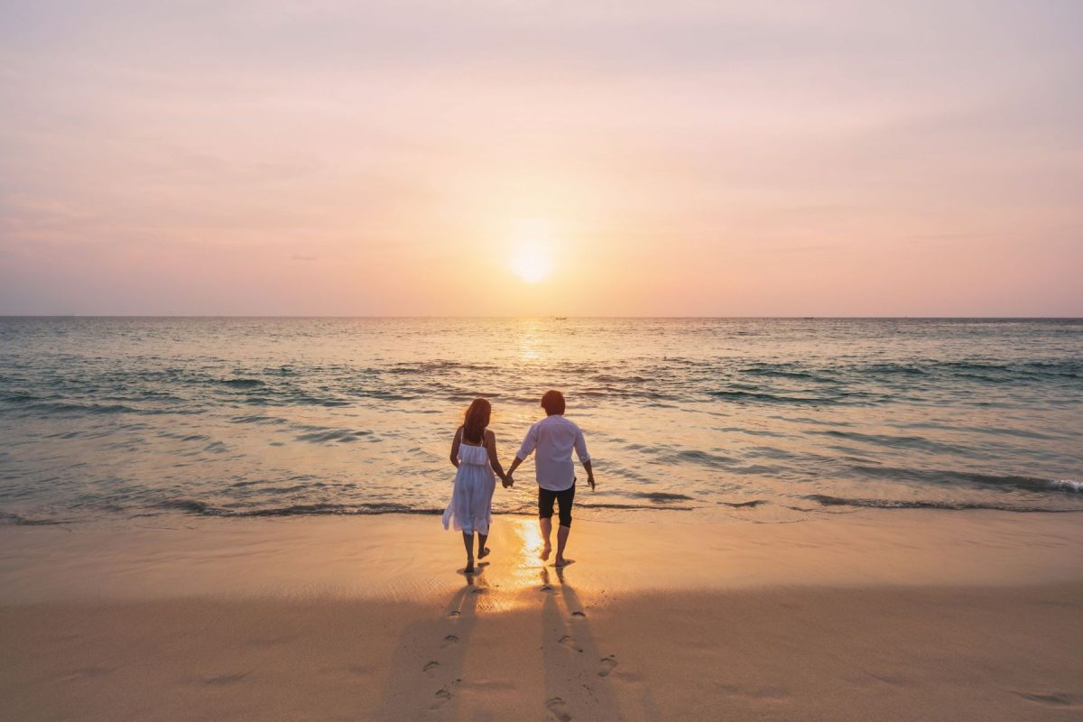 couple walking on Panama City Beach