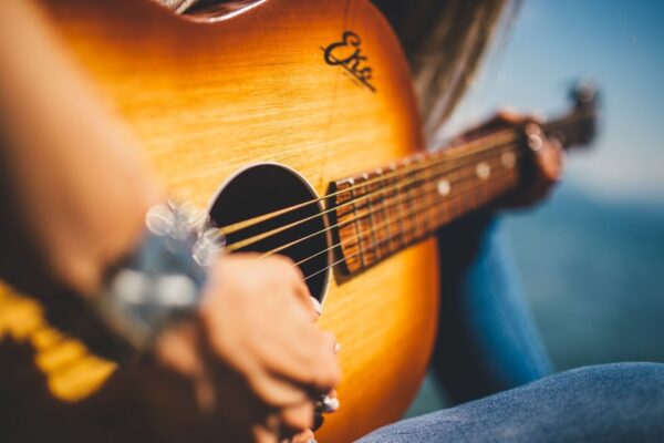 person playing a guitar