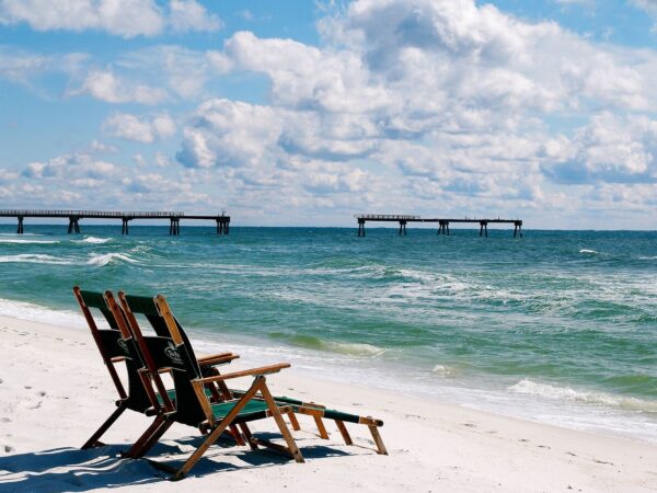 chairs on the beach facing the gulf