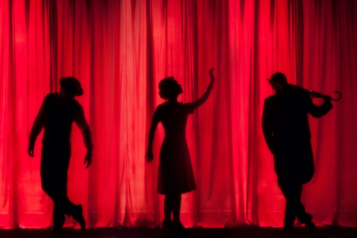 silhouettes on a theater curtain