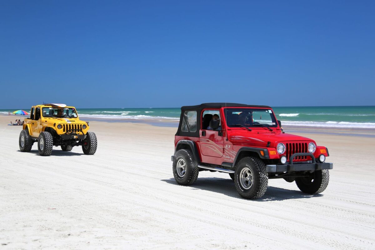 jeeps driving on the beach
