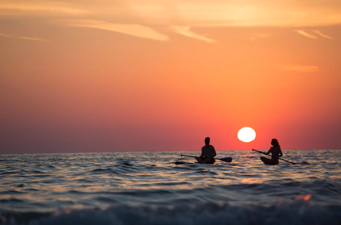 couple paddleboarding