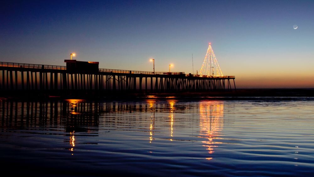Pier with lit up Christmas tree