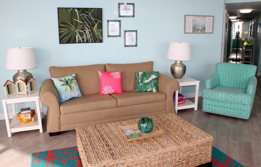 Interior of E606, a vacation rental in Panama City Beach, FL, featuring a furnished living room
