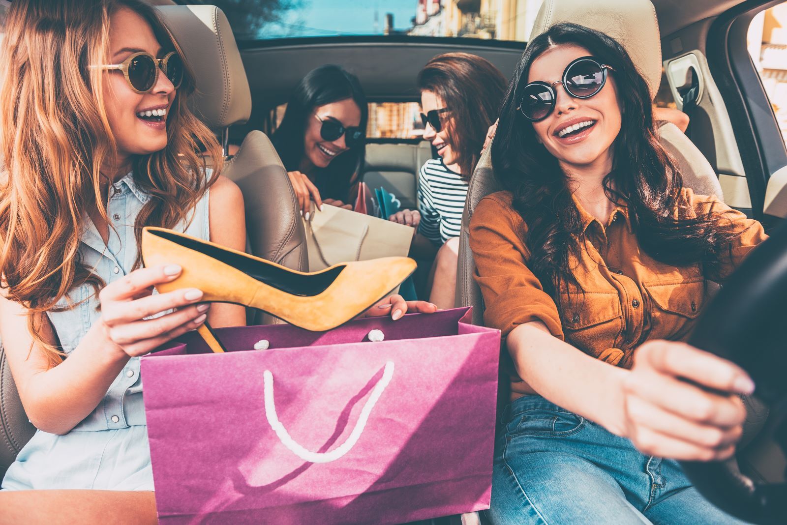 Friends in car after shopping