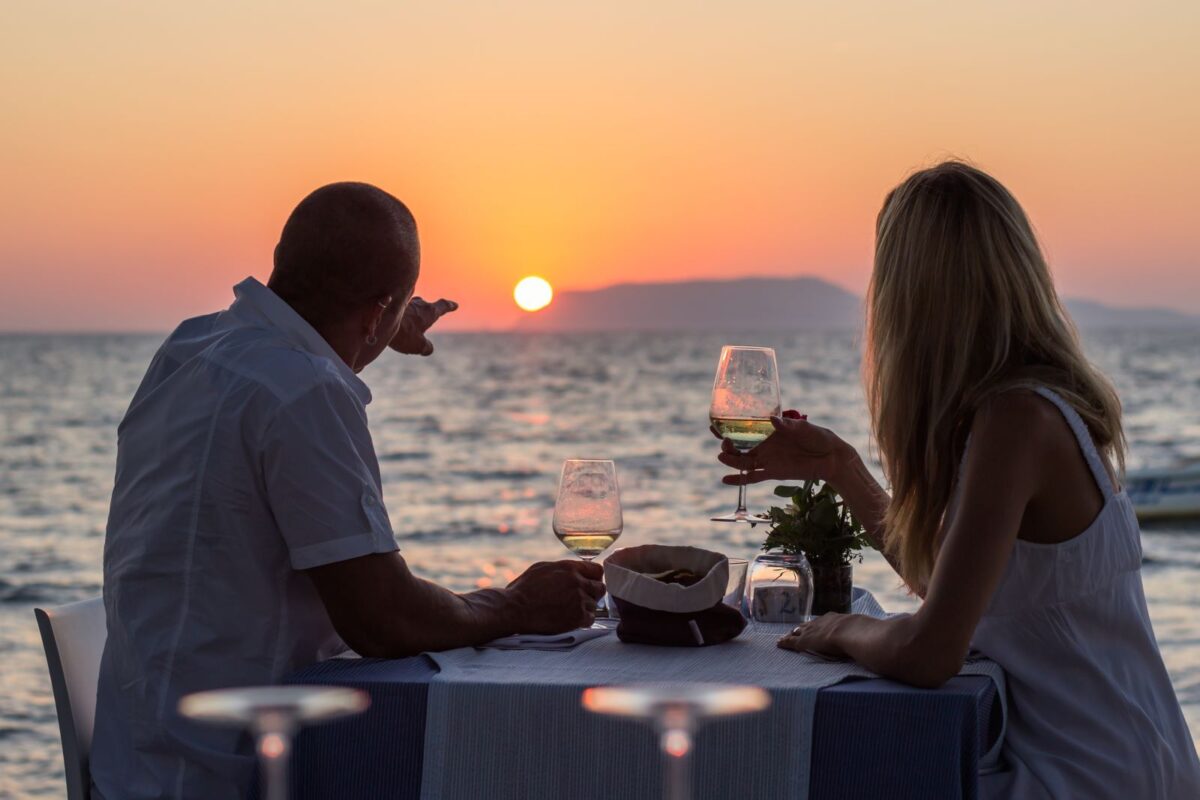 Couple enjoys dinner watching sunset